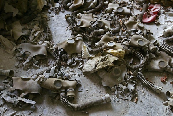 Abandoned gas masks lay on the floor in