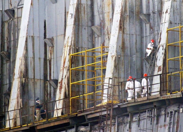Workers of construction crews, wearing m